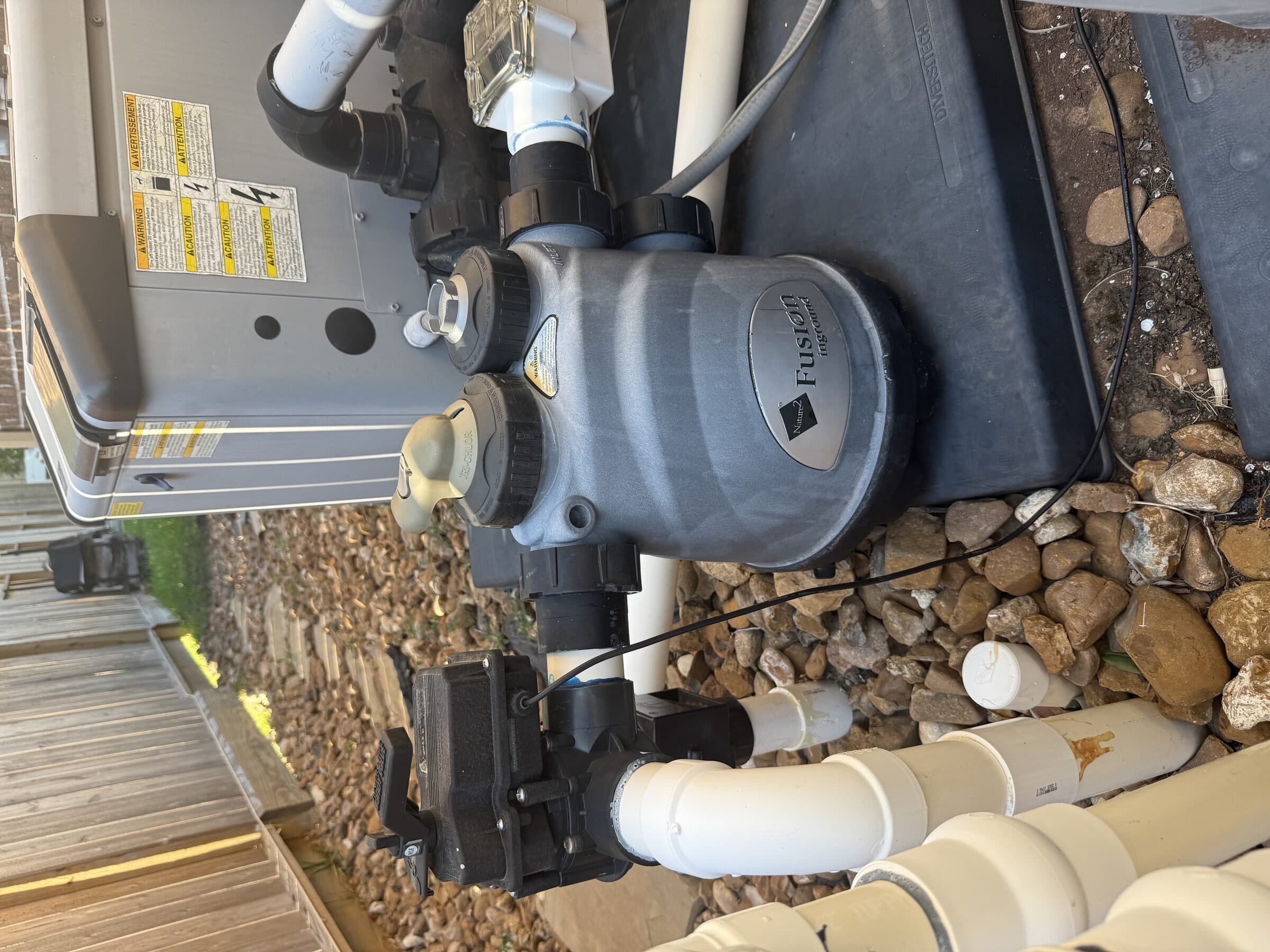 Residential pool equipment pad with pump and fusion filter — professional maintenance keeps your system running reliably