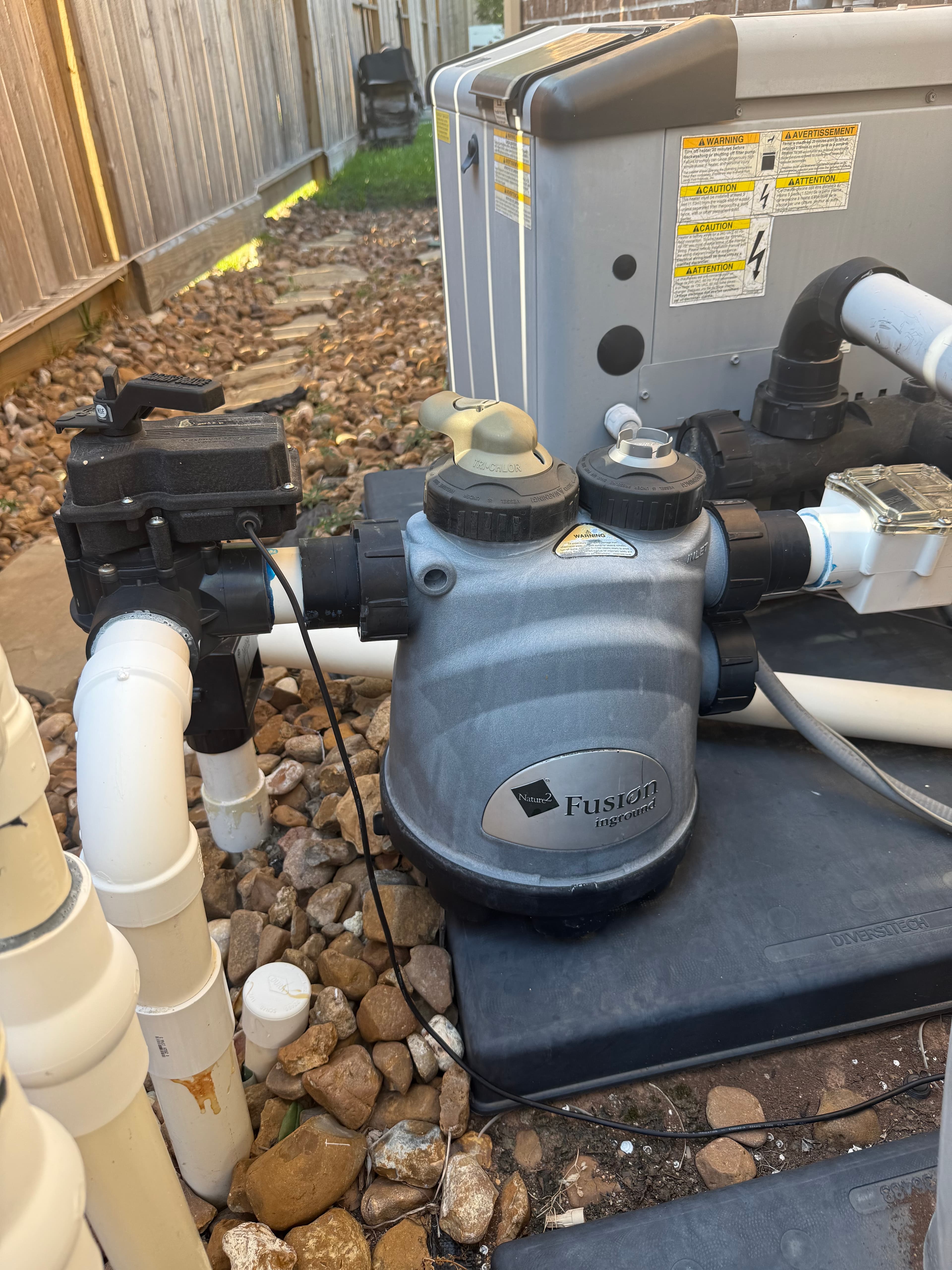 Residential pool equipment pad with pump and fusion filter — professional maintenance keeps your system running reliably